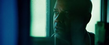 Movie still from “Unstoppable” (2010), directed by Tony Scott – A person looking out of a window; Close Up shot, Low angle