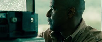 Movie still from “Unstoppable” (2010), directed by Tony Scott – A person sitting in a car; Close Up shot, Over the shoulder angle