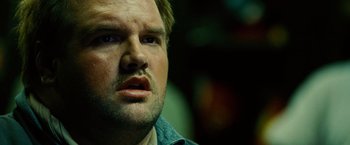 Movie still from “Unstoppable” (2010), directed by Tony Scott – A person looking at the camera; Close Up shot, Low angle