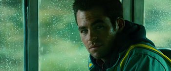 Movie still from “Unstoppable” (2010), directed by Tony Scott – A person looking out of a car window; Close Up shot, Low angle