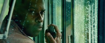 Movie still from “Unstoppable” (2010), directed by Tony Scott – A person talking on a cell phone; Close Up shot, Low angle
