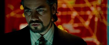 Movie still from “Unstoppable” (2010), directed by Tony Scott – A person wearing a suit and tie; Close Up shot, Over the shoulder angle