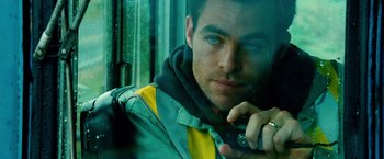 Movie still from “Unstoppable” (2010), directed by Tony Scott – A person talking on a cell phone; Close Up shot, Over the shoulder angle