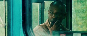 Movie still from “Unstoppable” (2010), directed by Tony Scott – A man brushing his teeth in the mirror; Close Up shot, Low angle