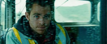 Movie still from “Unstoppable” (2010), directed by Tony Scott – A person in a car window; Close Up shot, Low angle