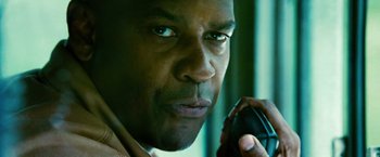 Movie still from “Unstoppable” (2010), directed by Tony Scott – A person talking on a cell phone; Close Up shot, Low angle