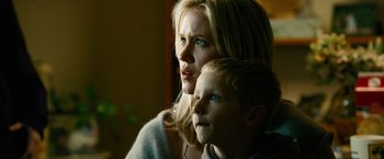 Movie still from “Unstoppable” (2010), directed by Tony Scott – A woman and a boy are looking at the camera; Close Up shot, Low angle