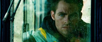 Movie still from “Unstoppable” (2010), directed by Tony Scott – A person looking out a car window; Close Up shot, Low angle