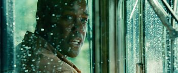 Movie still from “Unstoppable” (2010), directed by Tony Scott – A person looking out of a window; Close Up shot, Over the shoulder angle