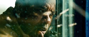 Movie still from “Unstoppable” (2010), directed by Tony Scott – A person looking out of a window; Extreme Close Up shot, Low angle