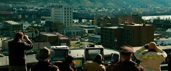Movie still from “Unstoppable” (2010), directed by Tony Scott – A group of people sitting in front of computer monitors; Extreme Wide shot, High angle