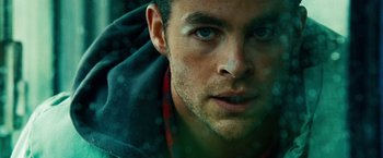 Movie still from “Unstoppable” (2010), directed by Tony Scott – A man's face in a rain storm; Extreme Close Up shot, Low angle