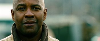 Movie still from “Unstoppable” (2010), directed by Tony Scott – A person wearing a jacket; Close Up shot, Over the shoulder angle
