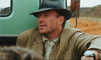 Movie still from “Until the End of the World” (1991), directed by Wim Wenders – A person wearing a hat; Close Up shot, Over the shoulder angle