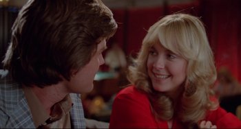 Movie still from “Used Cars” (1980), directed by Robert Zemeckis – A man and a woman talking to each other; Close Up shot, Over the shoulder angle