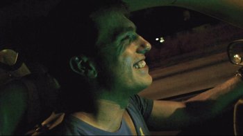 Movie still from “V/H/S” (2012), directed by Joe Swanberg – A person in a car; Close Up shot, Low angle