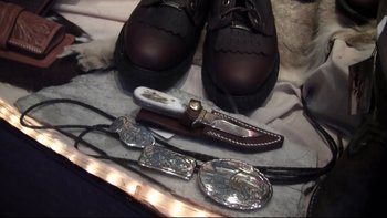 Movie still from “V/H/S” (2012), directed by Joe Swanberg – A pair of shoes and a pair of knifes; Extreme Close Up shot, Overhead angle