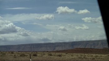 Movie still from “V/H/S” (2012), directed by Joe Swanberg – A view of a mountain range with a sky background; Extreme Wide shot, Low angle