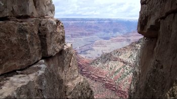 Movie still from “V/H/S” (2012), directed by Joe Swanberg – A view of the grand canyon taken from the top of a mountain; Extreme Wide shot, High angle