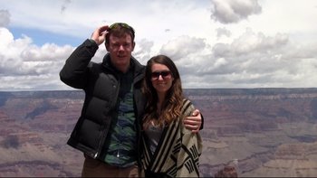 Movie still from “V/H/S” (2012), directed by Joe Swanberg – A man and a woman standing next to each other in front of the grand canyon; Extreme Wide shot, High angle