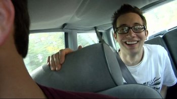 Movie still from “V/H/S” (2012), directed by Joe Swanberg – A man sitting in the back seat of a car; Close Up shot, Over the shoulder angle