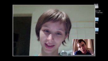 Movie still from “V/H/S” (2012), directed by Joe Swanberg – A young girl and a young man are smiling for the camera; Medium shot, Over the shoulder angle