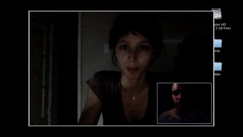 Movie still from “V/H/S” (2012), directed by Joe Swanberg – A woman and a man are in a dark room; Medium shot, Over the shoulder angle