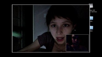 Movie still from “V/H/S” (2012), directed by Joe Swanberg – A young girl and an older man in a dark room; Close Up shot, Over the shoulder angle