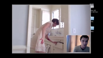 Movie still from “V/H/S” (2012), directed by Joe Swanberg – A woman in a white dress cleaning a bathroom mirror; Medium shot, High angle