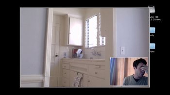 Movie still from “V/H/S” (2012), directed by Joe Swanberg – A person is taking a picture of a bathroom; Wide shot, High angle