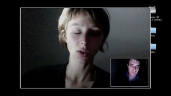 Movie still from “V/H/S” (2012), directed by Joe Swanberg – A young woman is talking on a video call with a young man; Close Up shot, Over the shoulder angle