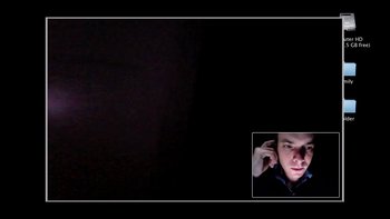 Movie still from “V/H/S” (2012), directed by Joe Swanberg – A picture of a man in a dark room; Extreme Wide shot, High angle
