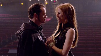 Movie still from “V/H/S Viral” (2014), directed by Aaron Moorhead – A man and a woman holding each others hands; Medium shot, Low angle