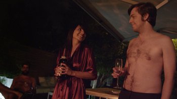 Movie still from “V/H/S Viral” (2014), directed by Aaron Moorhead – A man and a woman standing next to each other; Medium shot, Over the shoulder angle