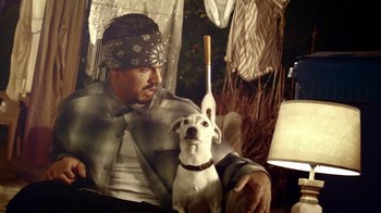 Movie still from “V/H/S Viral” (2014), directed by Aaron Moorhead – A man and a dog sitting next to each other in a room; Medium shot, Low angle