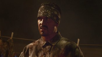 Movie still from “V/H/S Viral” (2014), directed by Aaron Moorhead – A man with a bandage on his head; Close Up shot, Over the shoulder angle