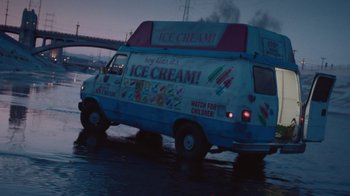 Movie still from “V/H/S Viral” (2014), directed by Aaron Moorhead – An ice cream truck driving down a flooded street; Extreme Wide shot, High angle