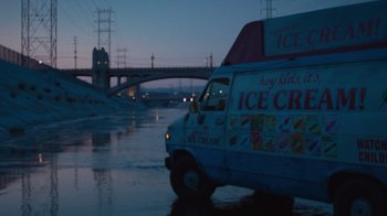 Movie still from “V/H/S Viral” (2014), directed by Aaron Moorhead – An ice cream truck driving down a flooded street; Extreme Wide shot, High angle
