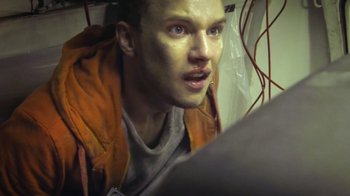 Movie still from “V/H/S Viral” (2014), directed by Aaron Moorhead – A person wearing a hooded jacket; Close Up shot, Overhead angle