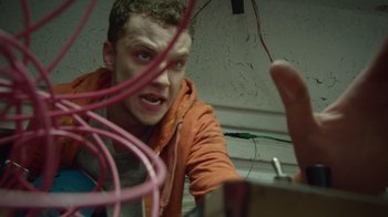 Movie still from “V/H/S Viral” (2014), directed by Aaron Moorhead – A young man is looking at a computer monitor; Close Up shot, Low angle