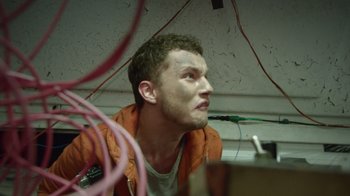 Movie still from “V/H/S Viral” (2014), directed by Aaron Moorhead – A young man is sitting in front of a computer; Close Up shot, Low angle
