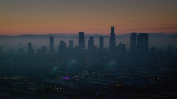 Movie still from “V/H/S Viral” (2014), directed by Aaron Moorhead – A view of a city skyline at dusk; Extreme Wide shot, High angle
