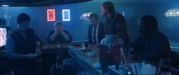 Movie still from “VFW” (2019), directed by Joe Begos – A group of men sitting at a bar drinking; Wide shot, Over the shoulder angle