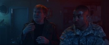 Movie still from “VFW” (2019), directed by Joe Begos – Two men in military uniforms are talking to each other; Medium shot, Over the shoulder angle