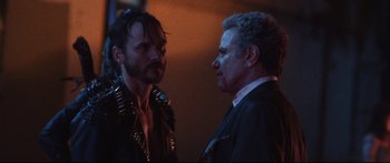 Movie still from “VFW” (2019), directed by Joe Begos – A man and a woman talking to each other; Close Up shot, Over the shoulder angle