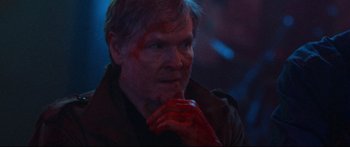 Movie still from “VFW” (2019), directed by Joe Begos – A man with blood all over his face and hands; Close Up shot, Over the shoulder angle