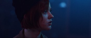 Movie still from “VFW” (2019), directed by Joe Begos – A person with short red hair; Close Up shot, Low angle