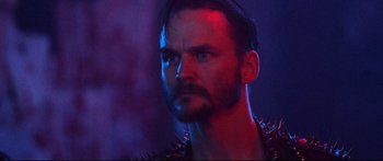 Movie still from “VFW” (2019), directed by Joe Begos – A person wearing a spiked jacket; Close Up shot, Low angle