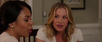 Movie still from “Vacation” (2015), directed by John Francis Daley – A woman sitting next to another woman at a table; Close Up shot, Over the shoulder angle