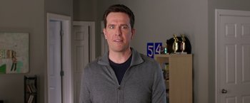 Movie still from “Vacation” (2015), directed by John Francis Daley – A person standing in a room; Medium shot, Over the shoulder angle